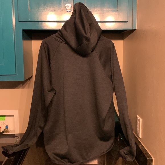 A XXL Under Armour blue sweatshirt with a pink woodland/camo pattern in hood. - Picture 2 of 4